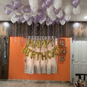 40 helium balloons and happy birthday foil